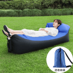 Person scooping air to inflate the portable sofa.