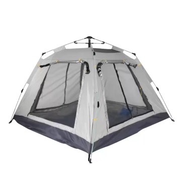 A 3-5 person automatic tent set up in a lush green meadow.