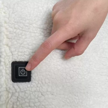 One-touch power button on heated camping chair for easy temperature control