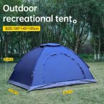 A hand-built outdoor camping tent set up in a flowery field for a couple.