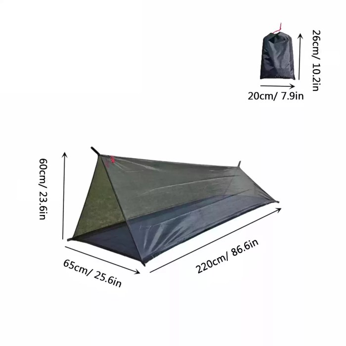 The compact portable tent standing stable on a grassy riverbank during a fishing trip.