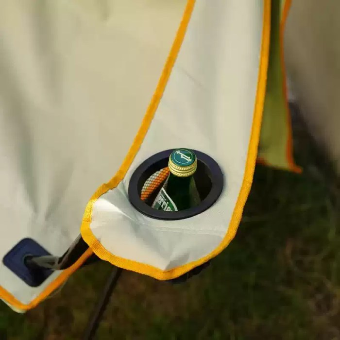 Cup holders at armrests of folding chair.