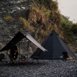 A group of campers sitting inside the spacious octagon pyramid shelter.