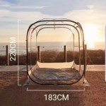 The PVC clear tent set up in a backyard as a modern garden igloo.