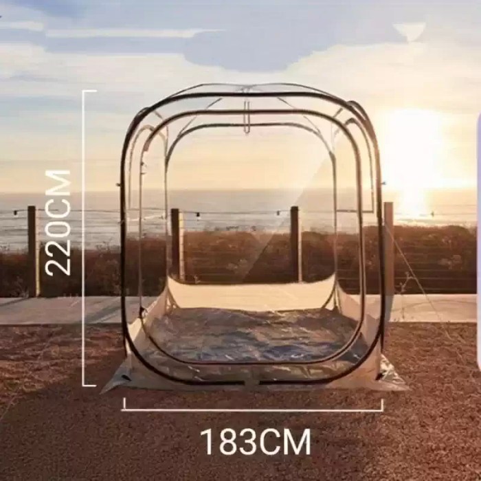 The PVC clear tent set up in a backyard as a modern garden igloo.