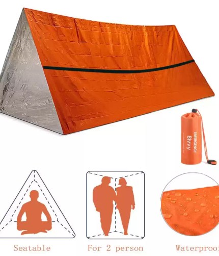 A 2 person emergency shelter bivy survival tent kit set up in a snowy forest for heat retention.