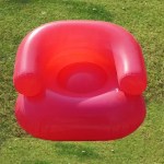 Blow up chair for kids at a family picnic.