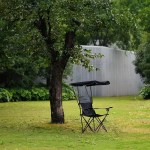 A person relaxing in the heat insulation armchair during a nature hike.