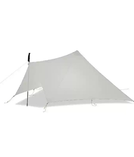 A hiker pitching the spire tent during a long-distance nature hike.