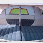 Large central walk-in living space in a 10-man family tent for gear storage and socialising.