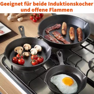Cast iron pans on gas hob cooking bacon, mushrooms and eggs, suitable for induction and camping stoves UK.