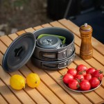 Compact nesting campsite cooking kit designed for space-saving storage in motorhome kitchen cupboards.