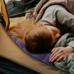 FJK Camping Gear inflatable pillow being used for lumbar support in an office.