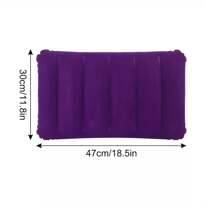 Compact folded FJK Camping Gear square pillow next to a travel laptop.