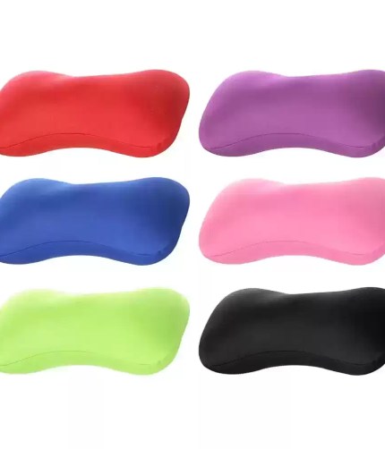 Ergonomic microbead bolster pillow providing lumbar and neck support for UK caravan and motorhome travel.