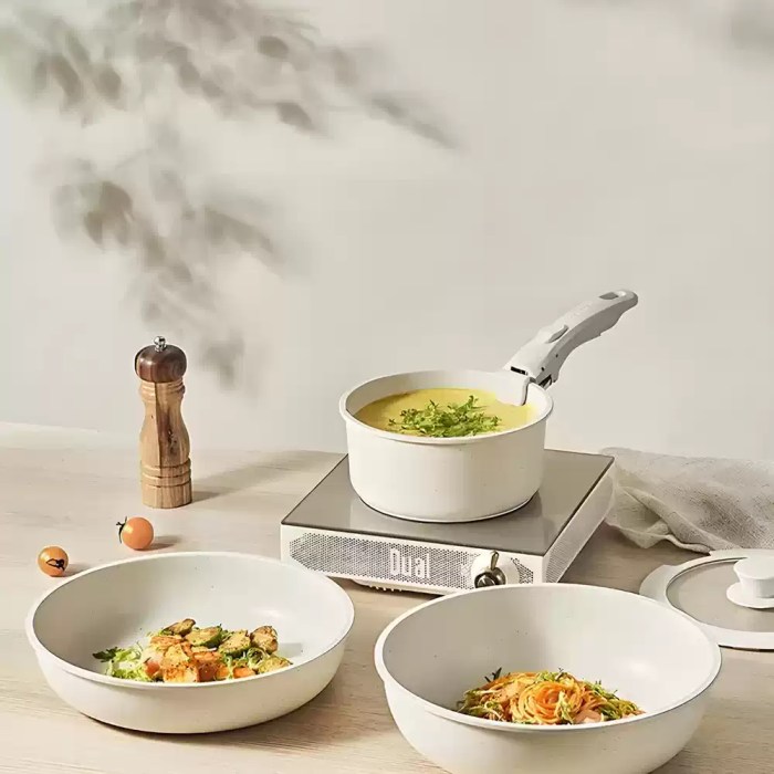 Compact nested motorhome pans designed for rattle-free travel in campervan storage drawers.