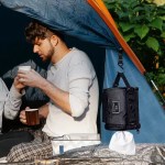 Tactical hanging roll paper bag used for convenience at UK campsite.