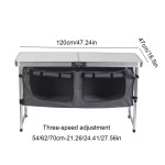 Multi-purpose height adjustable table used for family dining at UK campsite.