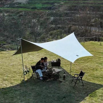 Lightweight Naturehike camping tarp providing shade for outdoor cooking and camping UK