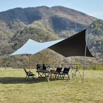 Naturehike large camping tarp canopy setup in open field for UK camping and hiking trips