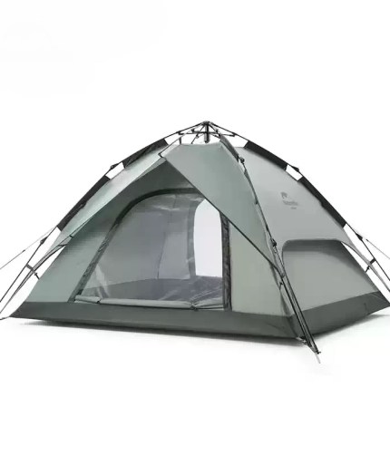 Green Naturehike automatic tent fully pitched on a lush UK campsite with guy lines secured.