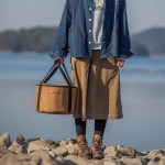 Spacious interior of round portable handbag for carrying camping essentials UK.