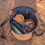 Water-resistant protective fabric on large capacity round handbag for UK weather.