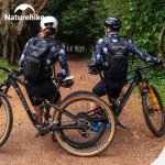 A cyclist wearing the Naturehike hydration pack while navigating a steep trail in the Peak District.