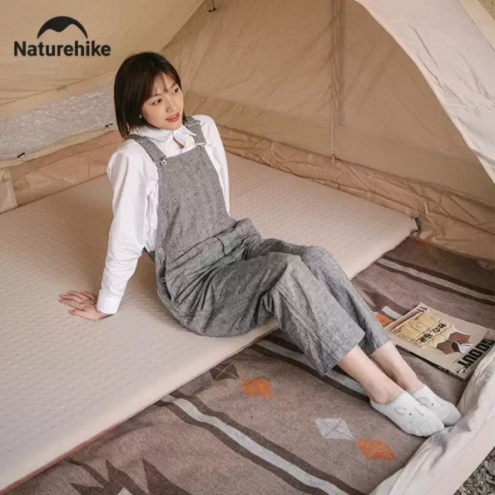 Portable self-inflating camping mat setup.