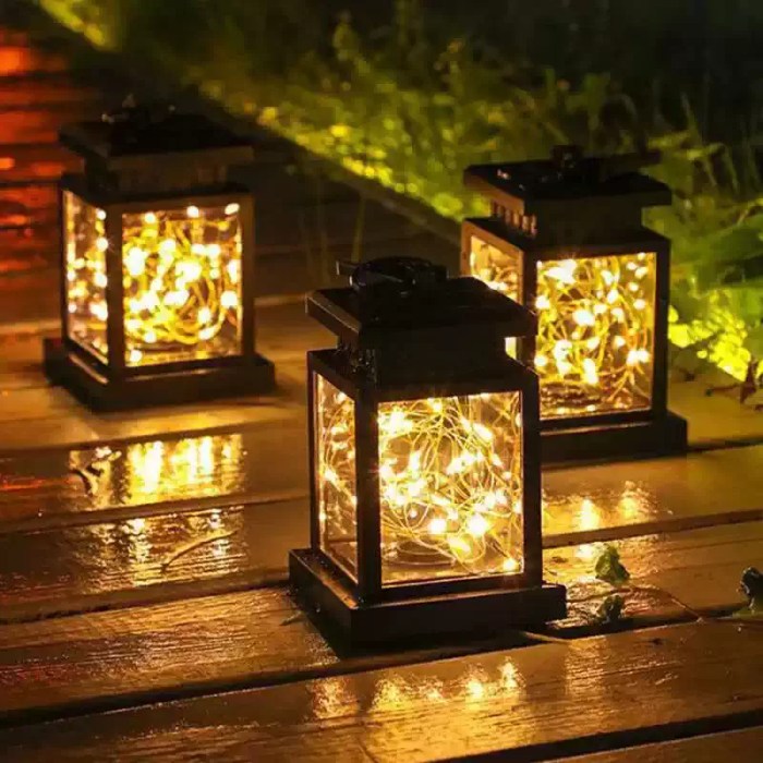 Decorative solar LED outdoor lanterns featuring an integrated high-efficiency solar panel for UK garden and campsite lighting.
