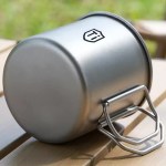 Heat-resistant metal trekking cup being used as a small cooking pot on a micro-stove in the Peak District.