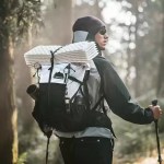 Helium 30+5L lightweight hiking backpack in grey and black outdoors