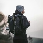 Helium 30+5L outdoor trekking backpack used by hiker at sunset
