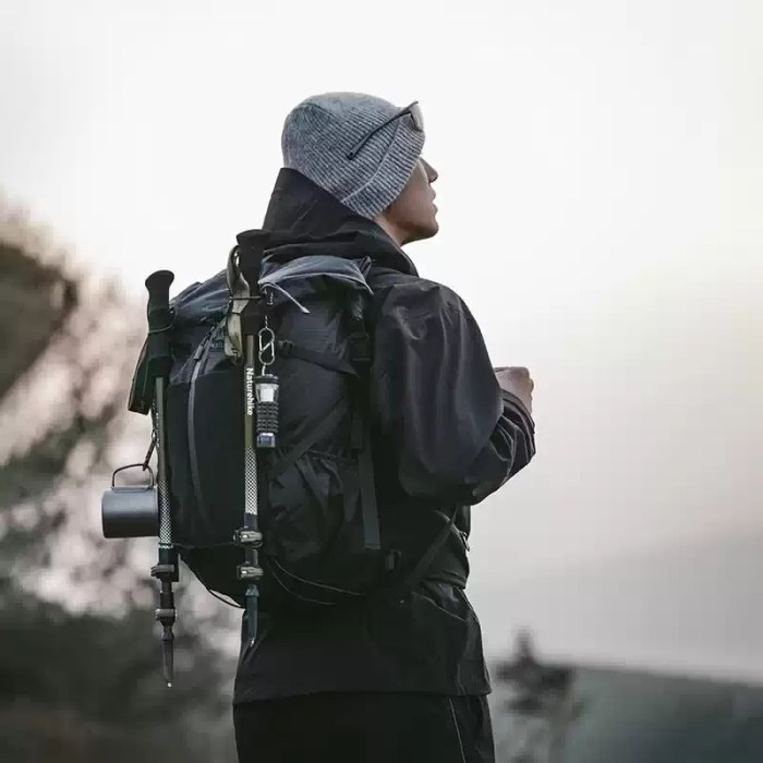 Helium 30+5L outdoor trekking backpack used by hiker at sunset