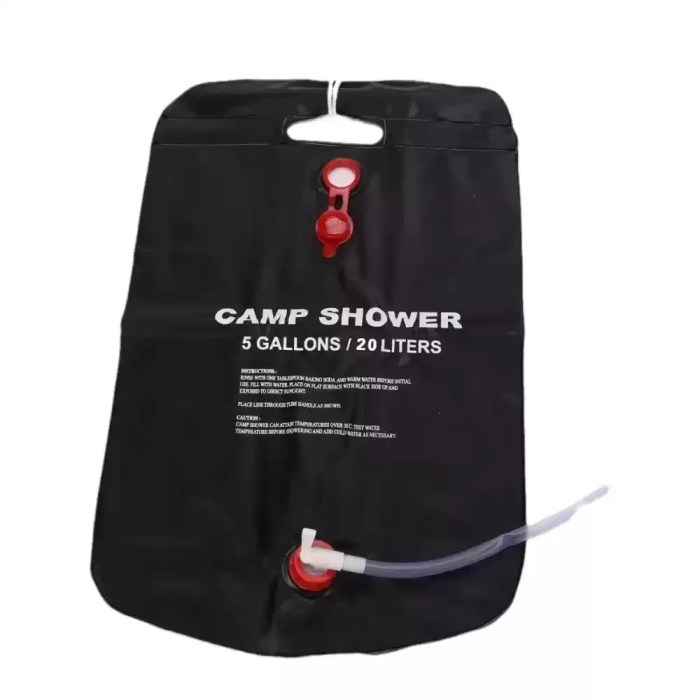 Portable 20L solar shower bag hanging for a UK forest campsite.
