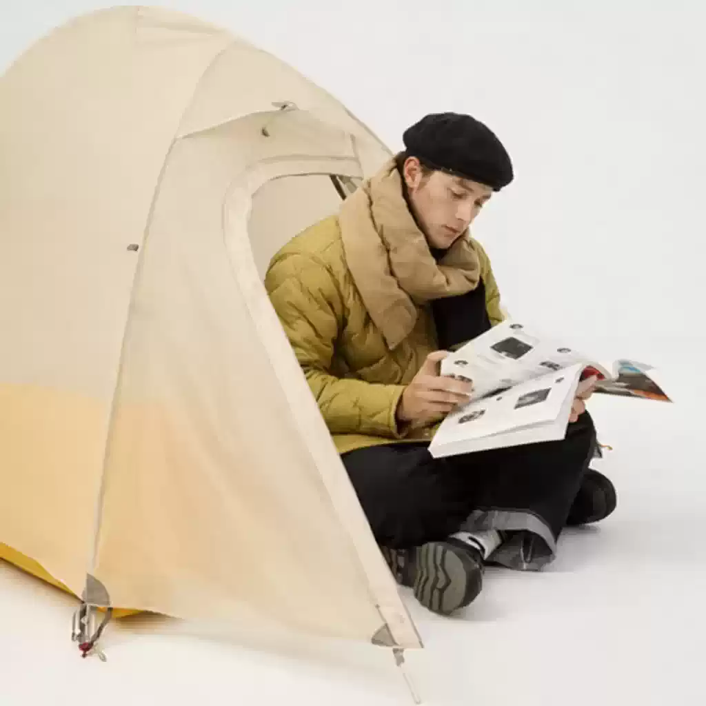 man inside tent wearing goose down neck cover winter camping warmth comfort