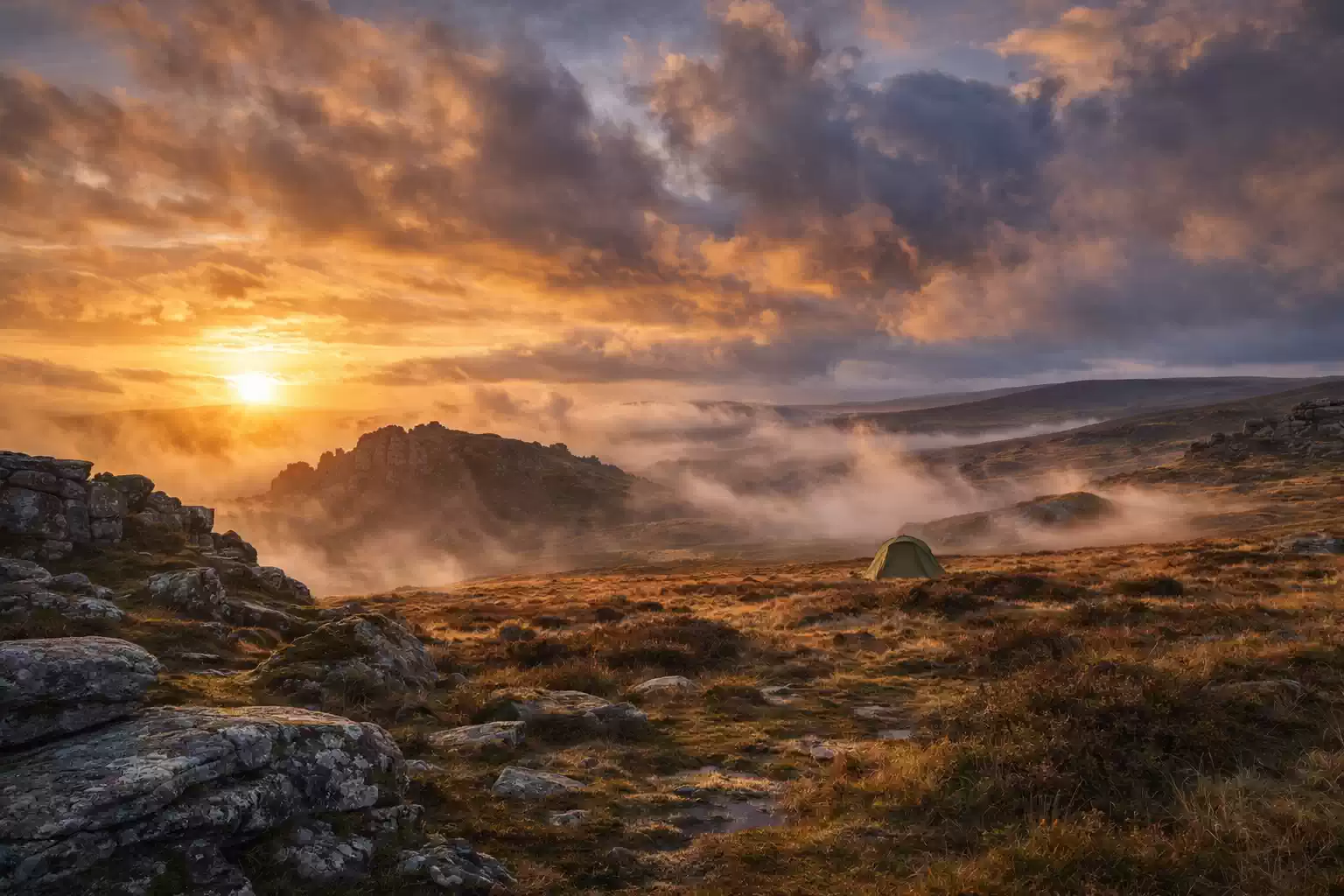 wild camping Dartmoor UK sunrise mist landscape tent remote moorland outdoor adventure