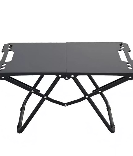 A high-angle shot of a black FJK Camping Gear tactical table showing its unique folding leg structure on a white background.