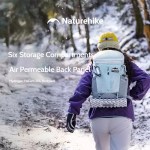 FJK Camping Gear Naturehike Helium 20L backpack in use during a winter hike, showing the air-permeable back panel and six storage compartments.