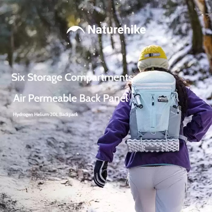 FJK Camping Gear Naturehike Helium 20L backpack in use during a winter hike, showing the air-permeable back panel and six storage compartments.