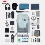 FJK Camping Gear Naturehike Helium 20L backpack storage capacity demonstration showing hiking essentials, electronics, and camping gear organized around the bag.