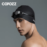 Man wearing Copozz black silicone swimming cap