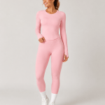 Women’s pink zip jacket, sports top and high-waisted leggings workout set