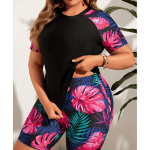 Women's tropical print long sleeve two-piece swimsuit with square neckline and high-waisted swim shorts.