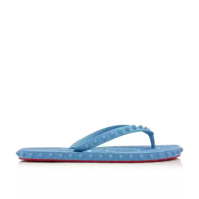 Sky blue studded rubber flip flops featuring spiked straps and textured soles for casual pool and beach wear.