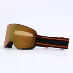 Gold mirrored ski goggles with a brown frame and adjustable strap