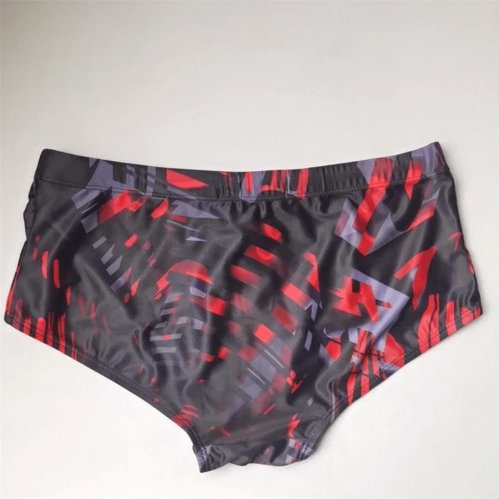 Close-up of men's Brazilian swim trunks featuring premium stretch fabric and athletic fit.
