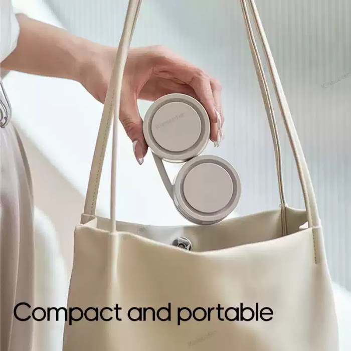 FJK Camping Gear outdoor neck fan being folded and placed into a cream-colored handbag, emphasizing its compact and portable design.