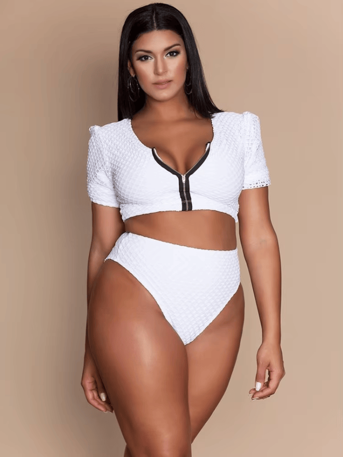 Women's white plus size monokini swimsuit featuring front zip, V-neck design and quick-dry comfort.