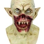 Front view of scary green zombie mask with sharp teeth and pointed ears